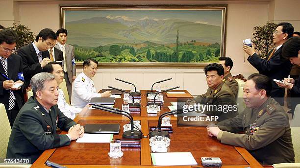 South Korea's Major General Han Min-Koo and North Korea's Lieutenant General Kim Yong-Chol hold discussions during the third and final day of...