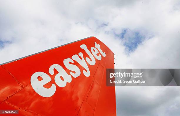 The logo of discount airline Easyjet is written across the tail of one of the company's planes at Schoenefeld Airport May 17, 2006 in Berlin,...