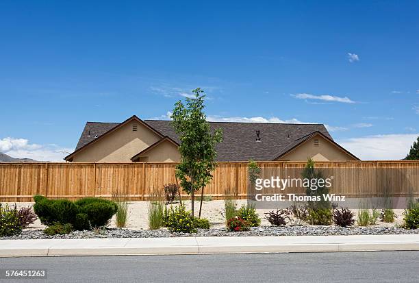 new home and fence - street stock pictures, royalty-free photos & images