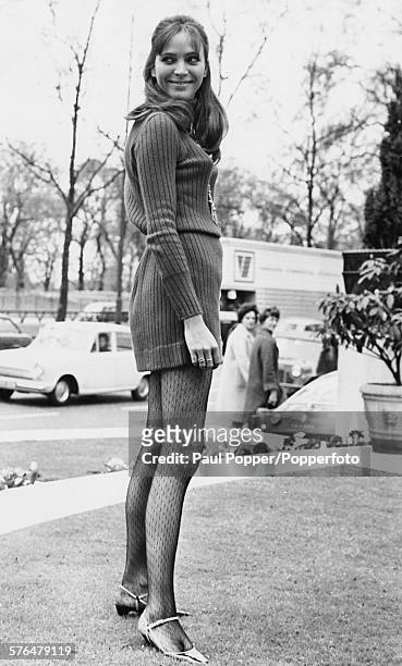 Danish actress Anna Karina pictured wearing a sweater dress as she poses for the cameras in Park Lane, London before the gala premiere of her film...