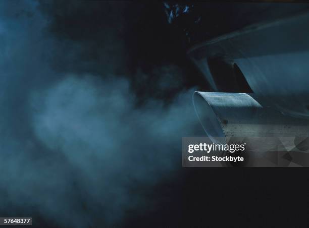 a exhaust pipe of a car emitting fumes - black smoke stock pictures, royalty-free photos & images