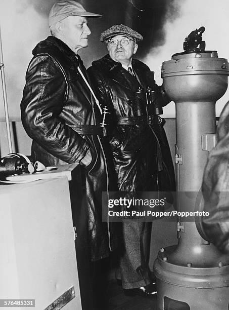 President of the United States, Harry S Truman with Fleet Admiral Chester W Nimitz on the bridge of the giant aircraft carrier USS Franklin D...