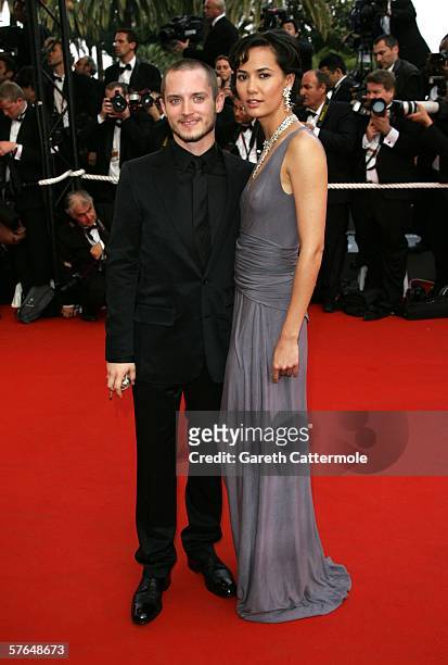Actor Elijah Wood and guest Pamela Racine attend the 'Paris Je T'aime' premiere during the 59th International Cannes Film Festival May 18, 2006 in...