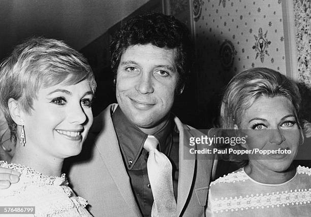Welsh singer Tom Jones pictured with his arms around fellow singers Shirley Jones and Line Renaud, after his performance in Las Vagas, Nevada, circa...