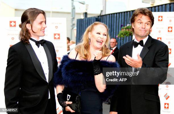 Edinburgh, UNITED KINGDOM: Swiss Hollywood film star Ursula Andress arrives with her son Dimitri Hamlin and former partner Harry Hamlin at The Royal...