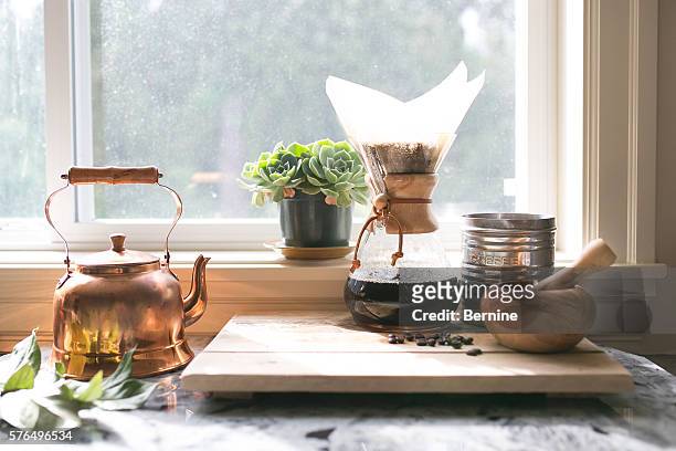 eye-level view of coffee and kettle and succulent - ceremony bildbanksfoton och bilder