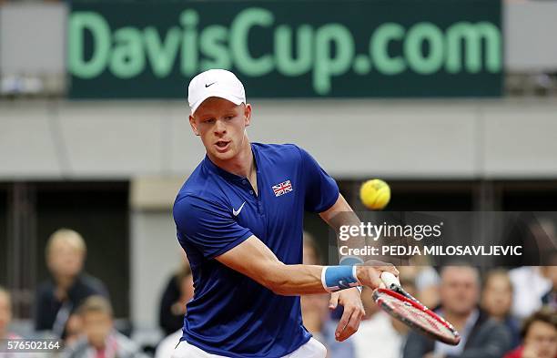 Great Britain's tennis player Kyle Edmund returns the ball to Serbia's tennis player Janko Tipsarevic during the Davis Cup World Group quarter final...