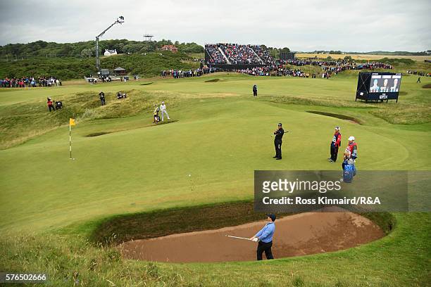 Rory McIlroy of Northern Ireland hits from the coffin bunker on the 8th hole during the second round on day two of the 145th Open Championship at...