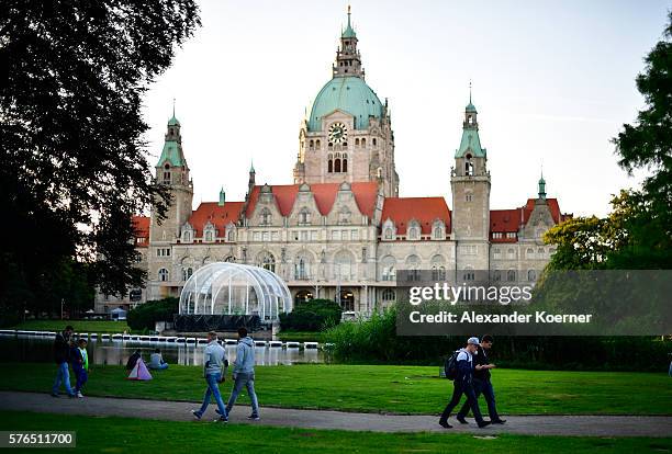 Young players walk through the city centre of Hanover while holding their smartphones and playing "Pokemon Go" on July 15, 2016 in Hanover, Germany....