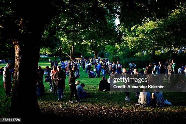 Young players walk through the city centre of Hanover while holding their smartphones and playing "Pokemon Go" on July 15, 2016 in Hanover, Germany....