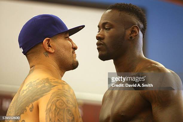 Chris Arreola and WBC World Heavyweight Champion Deontay Wilder stare each other down during their weigh-in at Legacy Arena at the BJCC on July 15,...