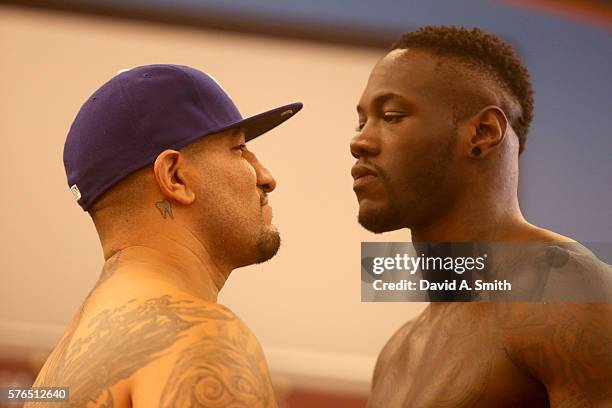 Chris Arreola and WBC World Heavyweight Champion Deontay Wilder stare each other down during their weigh-in at Legacy Arena at the BJCC on July 15,...