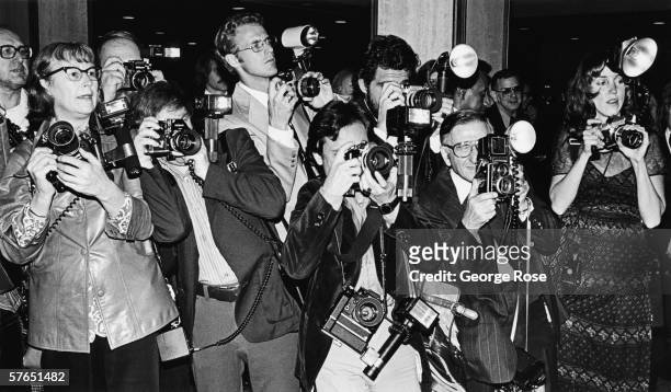 Crowd of paparazzi struggle to take photos of arriving musical celebrity at the annual Grammy Awards in Los Angeles, California.