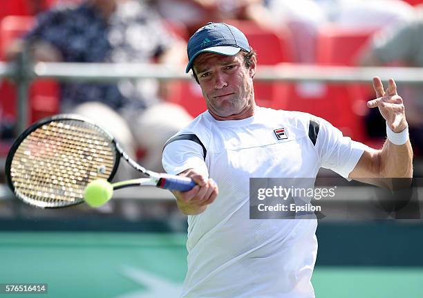 Teymuraz Gabashvili of Russia returns the ball to Thiemo De Bakker of Netherlands during the Davis Cup second round tie between Russia and the...