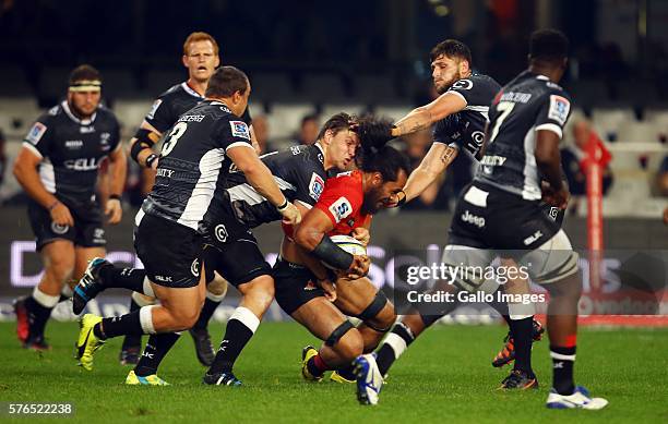 Etienne Oosthuizen of the Cell C Sharks tackling Liaki Moli of the Sunwolves during the Super Rugby match between the Cell C Sharks and Sunwolves at...