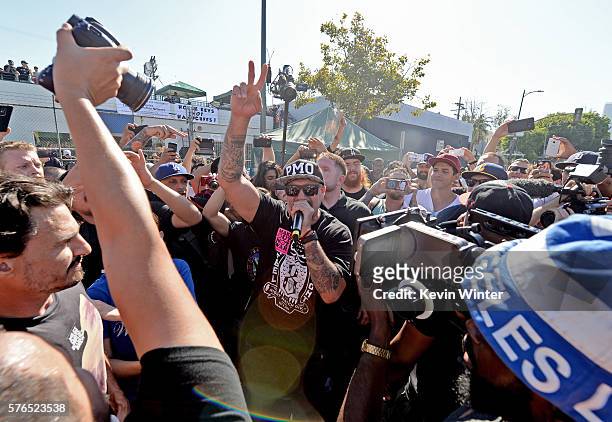 Singer B-Real of Prophets of Rage performs in the crowd during a free show on skid row on July 15, 2016 in Los Angeles, California.