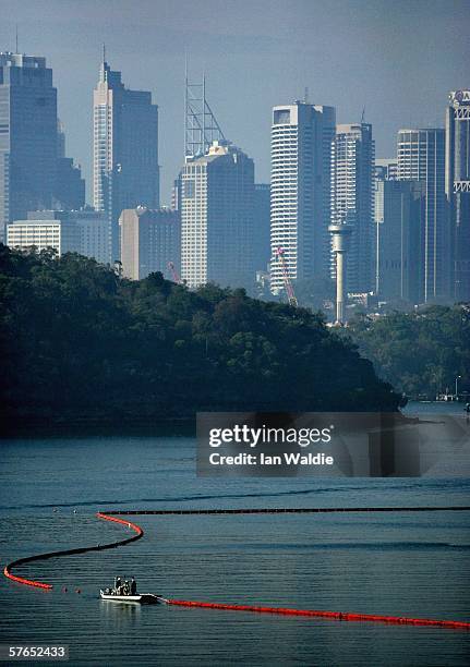 Crews from Sydney Ports and Shell Australia's Gore Bay terminal deploy oil spill containment booms during an exercise May 19, 2006 in Sydney,...