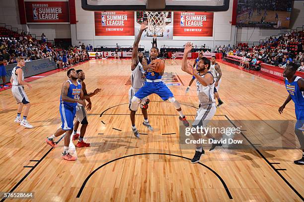 Korie Lucious of the Golden State Warriors goes to the basket against the Dallas Mavericks during the 2016 NBA Las Vegas Summer League game on July...