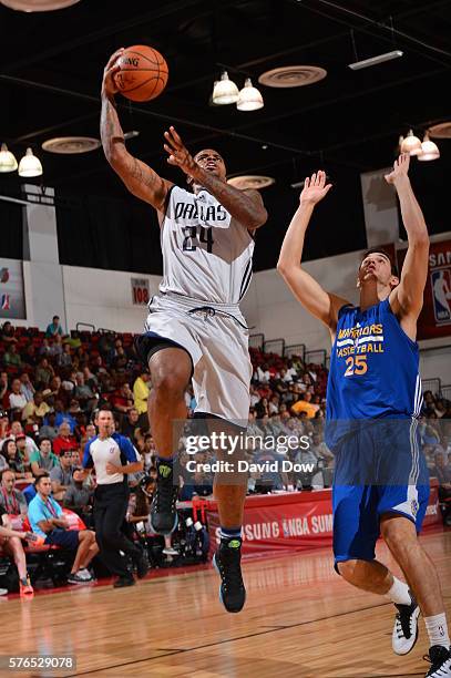 Chane Behanan of the Dallas Mavericks goes to the basket against Rosco Allen of the Golden State Warriors during the 2016 NBA Las Vegas Summer League...