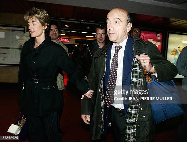 French former Prime minister and former Bordeaux mayor Alain Juppe and wife Isabelle, arrive at Bordeaux railway station, southwestern France, 19 May...
