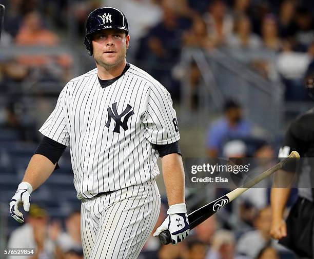 Brian McCann of the New York Yankees reacts after striking out in the ninth inning against the Boston Red Sox at Yankee Stadium on July 15, 2016 in...