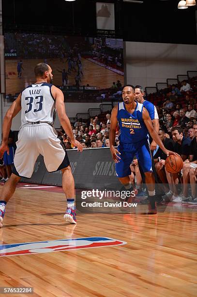 Landry Fields of the Golden State Warriors handles the ball against Perry Ellis of the Dallas Mavericks during the 2016 NBA Las Vegas Summer League...