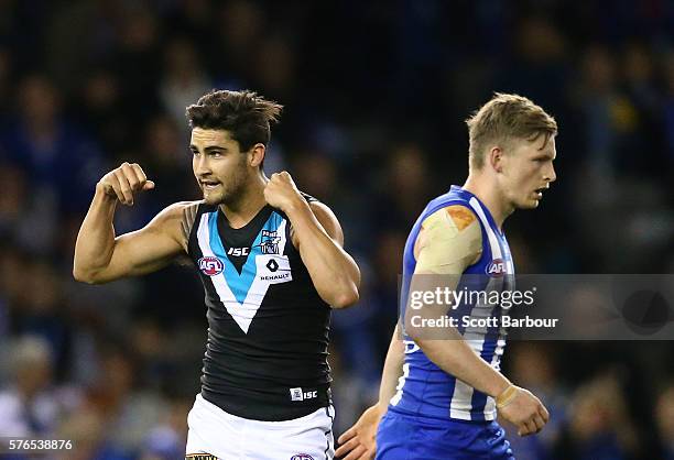 Chad Wingard of the Power celebrates after kicking a goal as Jack Ziebell of the Kangaroos looks on during the round 17 AFL match between the North...