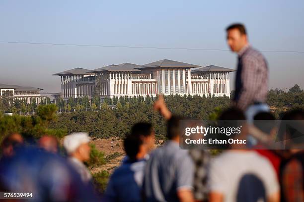 People watch the Presidential Palace July 16, 2016 in Ankara, Turkey. Istanbul's bridges across the Bosphorus, the strait separating the European and...