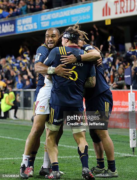 Patrick Osborne of the Highlanders celebrates the try of Dan Pryor during the round 17 Super Rugby match between the Highlanders and the Chiefs at...