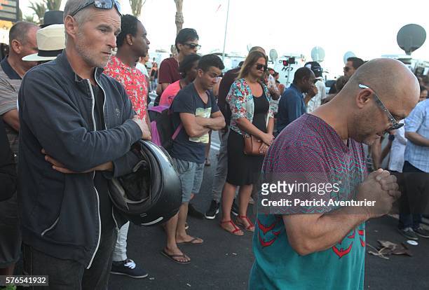 People gather and lay tributes on the Promenade des Anglais on July 15, 2016 in Nice, France.A French-Tunisian attacker killed 84 people as he drove...