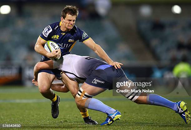 James Dargaville of the Brumbies is tackled during the round 17 Super Rugby match between the Brumbies and the Force at GIO Stadium on July 16, 2016...