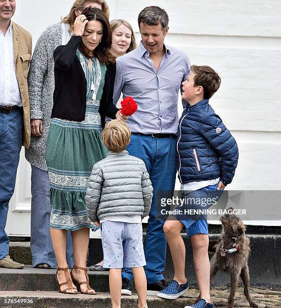 Danish royal house poses on front steps in the inner courtyard for the annual photo session on July 15, 2016 at Graasten Castle in Denmark. Crown...