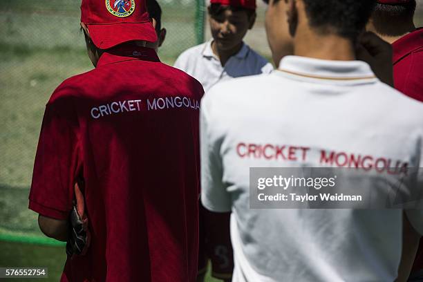 Young Mongolians take a break during a cricket nets session at MACA Mongolian Friendship Cricket Ground on July 16, 2016 in Ulaanbaatar, Mongolia....