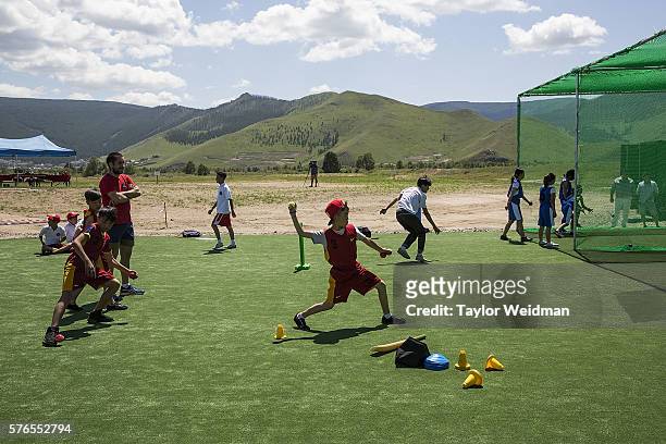 Mongolian and expatriate players take part in a cricket nets session at MACA Mongolian Friendship Cricket Ground on July 16, 2016 in Ulaanbaatar,...