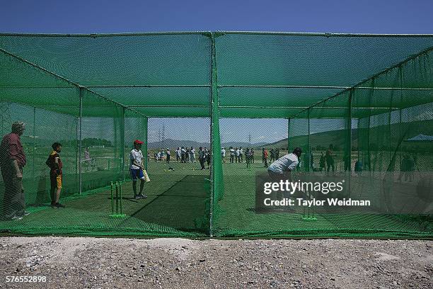 Mongolian and expatriate players take part in a cricket nets session at MACA Mongolian Friendship Cricket Ground on July 16, 2016 in Ulaanbaatar,...