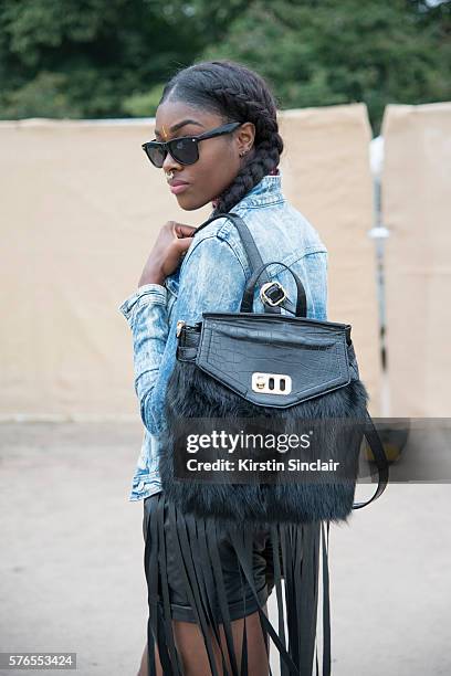 Britains next top model runner up Alysha White wears a Primark jacket, Asos shorts and sunglasses and a LYDC bag on day 1 of Lovebox Festival on July...