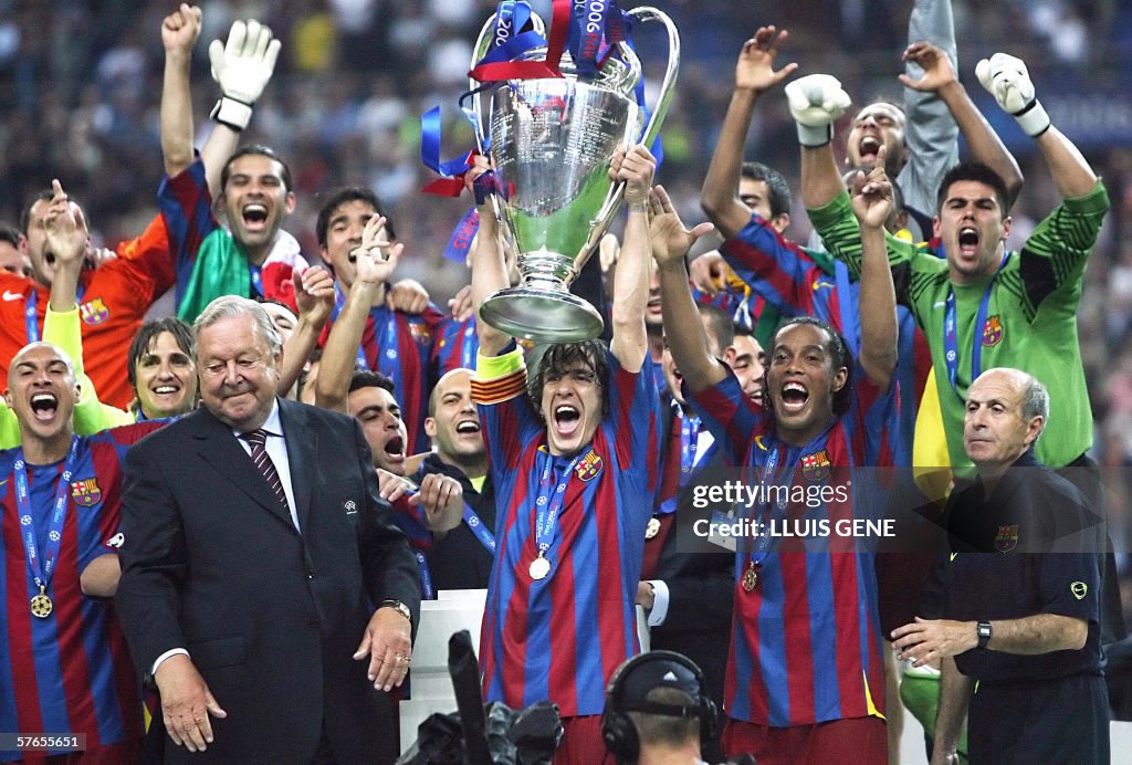 Barcelona's players hold the trophy afte
