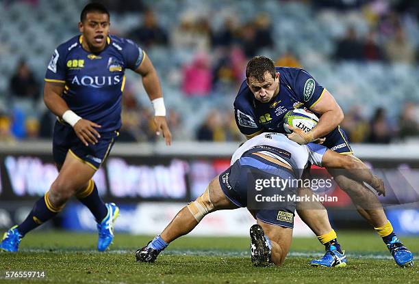 Ruan Smith of the Brumbies is tackled during the round 17 Super Rugby match between the Brumbies and the Force at GIO Stadium on July 16, 2016 in...