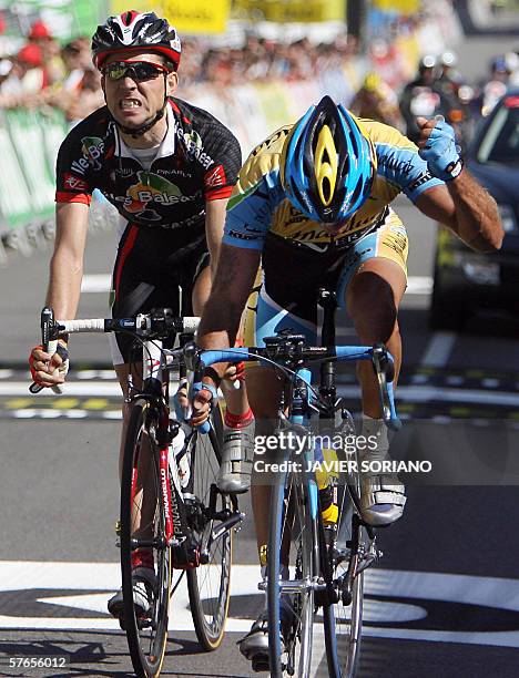 Spanish Adolfo Garcia Quesada celebrates his victory on the finish line against David Arroyo during the fifth stage of Catalunya's Tour, Llivia to...