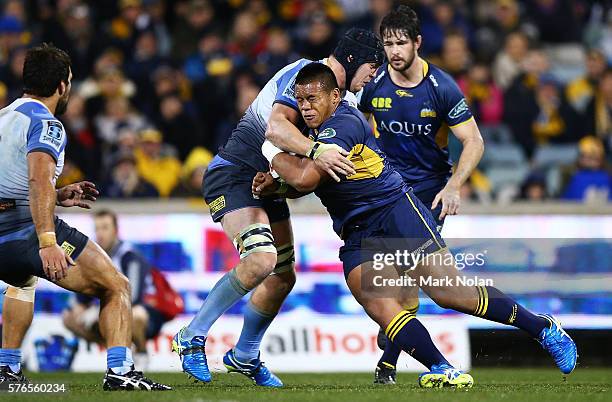 Allan Alaalatoa of the Brumbies is tackled during the round 17 Super Rugby match between the Brumbies and the Force at GIO Stadium on July 16, 2016...