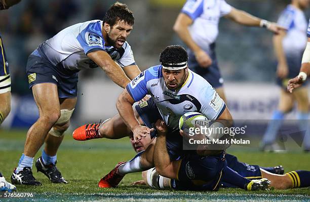 Pekahou Cowan of the Force is tackled during the round 17 Super Rugby match between the Brumbies and the Force at GIO Stadium on July 16, 2016 in...