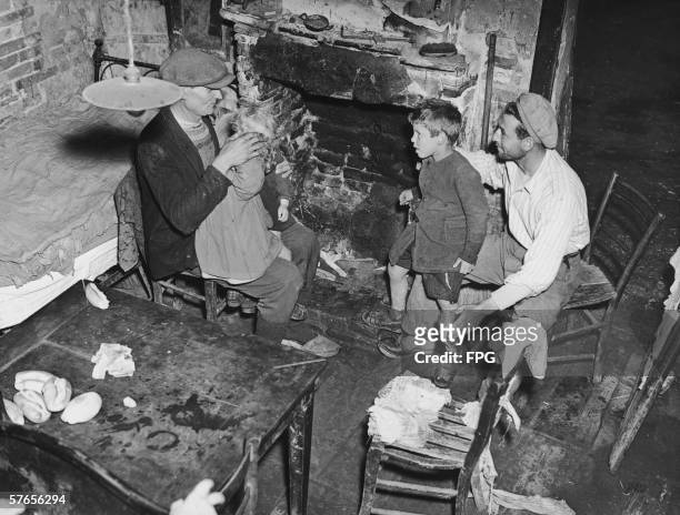 Family of villagers in Commachio share a typical one-room dwelling, October 1950.
