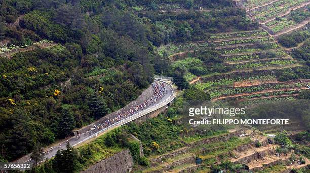 The pack rides through a coast road during the twelve stage of Giro D'Italia cycling tour from Livorno to Sestri Levante, 19 May 2006. Spain's Joan...