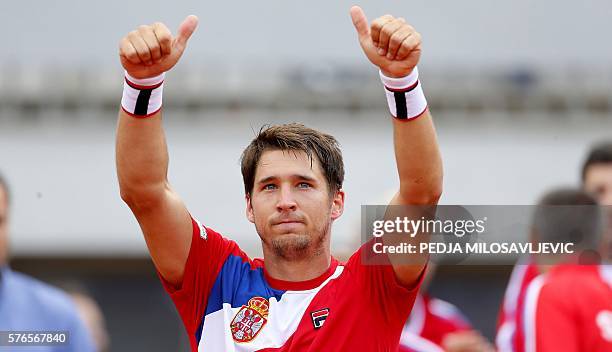 Serbia's tennis player Dusan Lajovic celebrate after defeating James Ward of Great Britain during the Davis Cup World Group quarter final single...