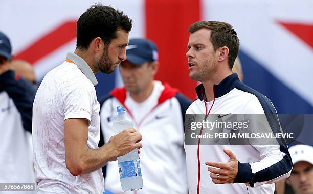 Great Britain's tennis player James Ward speaks to his team captain Leon Smith during the Davis Cup World Group quarter final single match between...