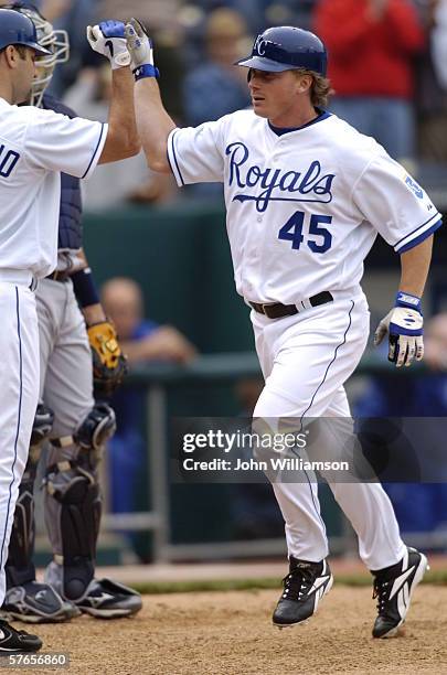 Right fielder Aaron Guiel of the Kansas City Royals celebrates scoring a run during the game against the Cleveland Indians at Kauffman Stadium on May...