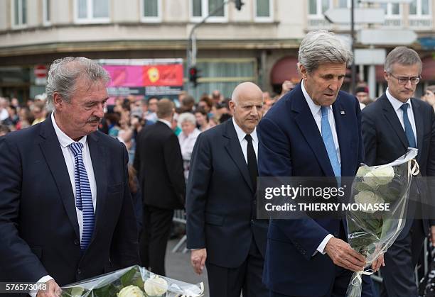 Luxembourg Minister of Foreign Affairs Jean Asselborn and US Secretary of State John Kerry lay white roses as they pay tribute to the victims of the...