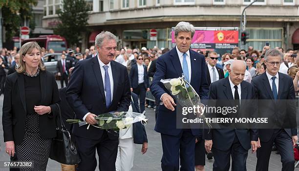 Luxembourg Minister of Foreign Affairs Jean Asselborn and US Secretary of State John Kerry lay white roses as they pay tribute to the victims of the...