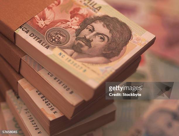 close-up of stacks of italian bank notes - italian currency stock-fotos und bilder