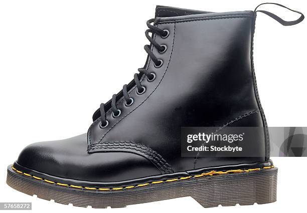 a leather boot - black boot fotografías e imágenes de stock